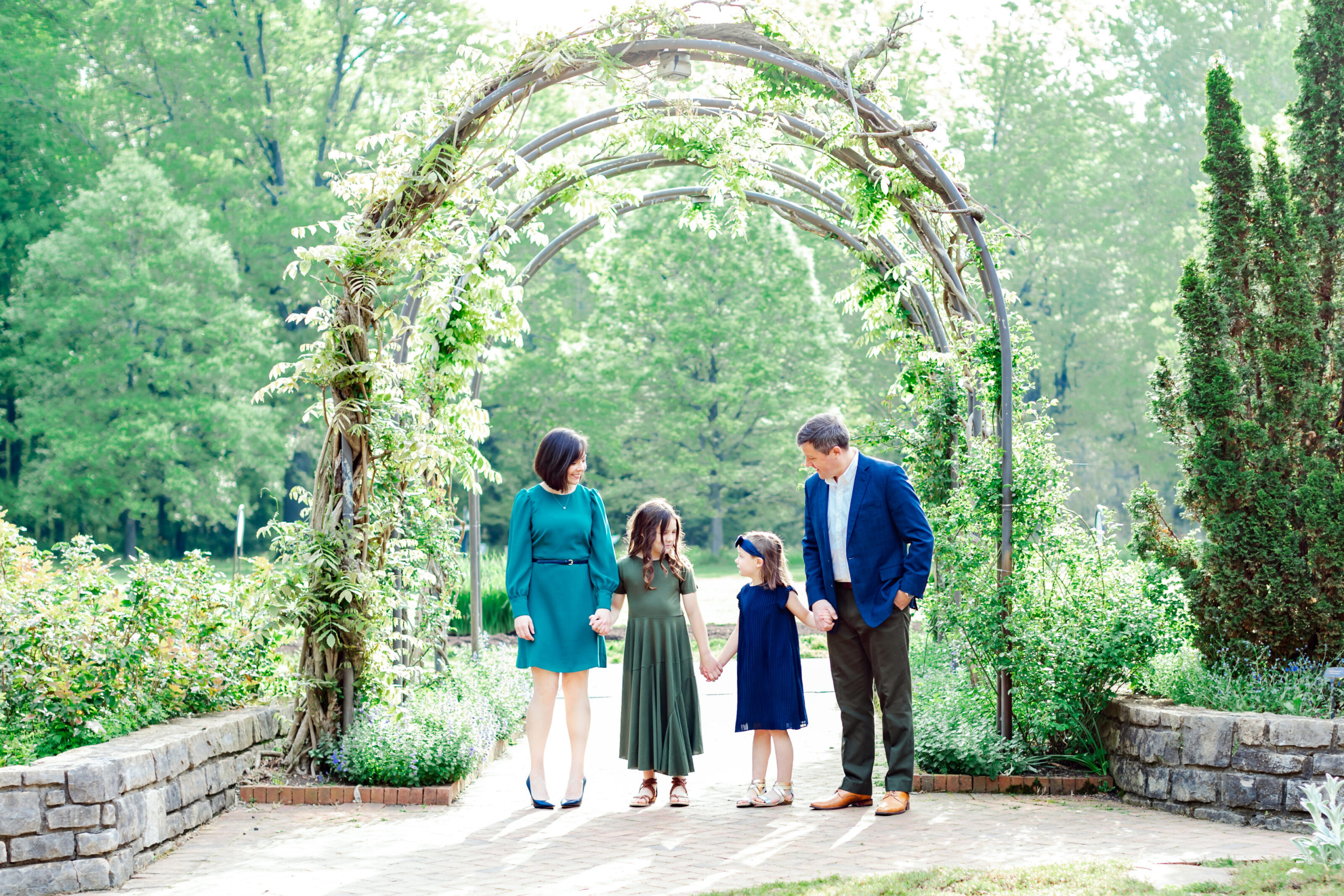 family photo under green arches